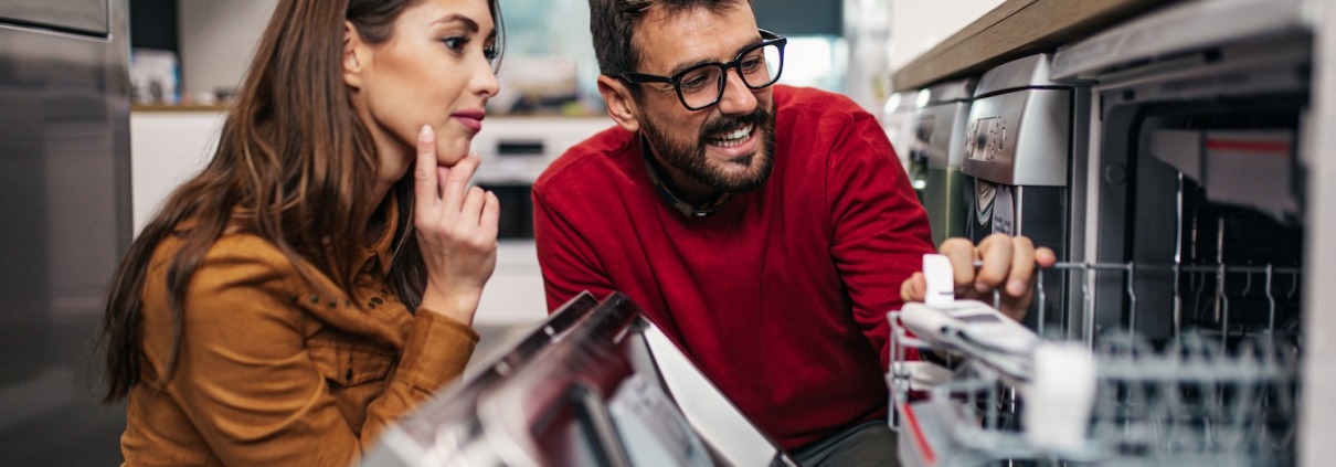 man and woman shopping for a dishwasher