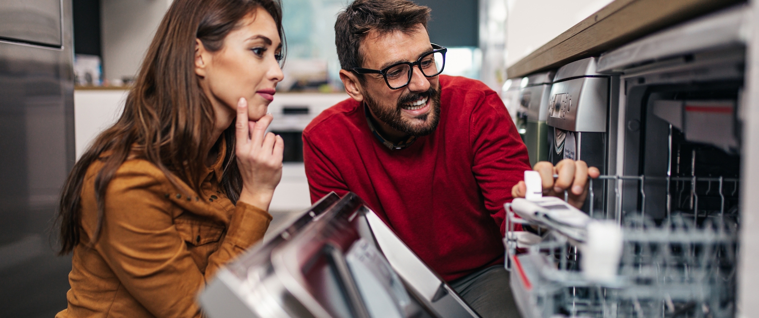 man and woman shopping for a dishwasher