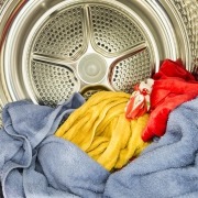 Interior view of tumble dryer with drying clothes
