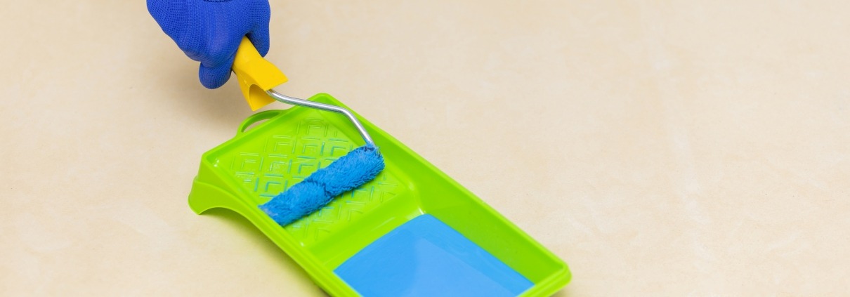 High angle picture of hand and paint roller