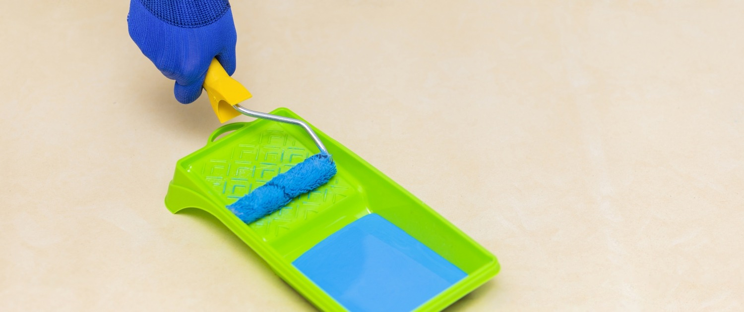 High angle picture of hand and paint roller