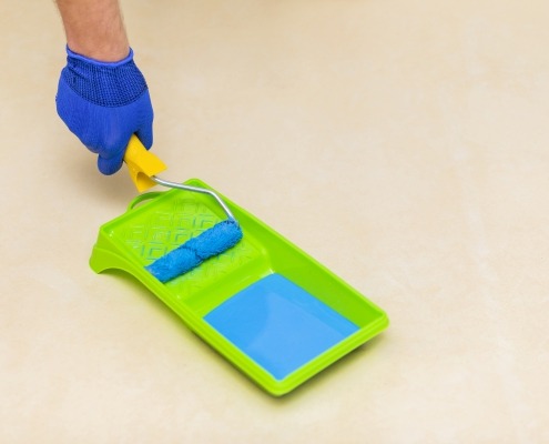 High angle picture of hand and paint roller