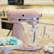 Pink stand mixer beside teal snowflake cookies
