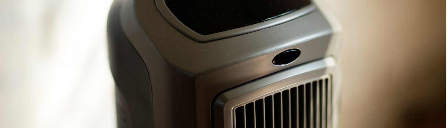 black slim electric portable space heater standing up