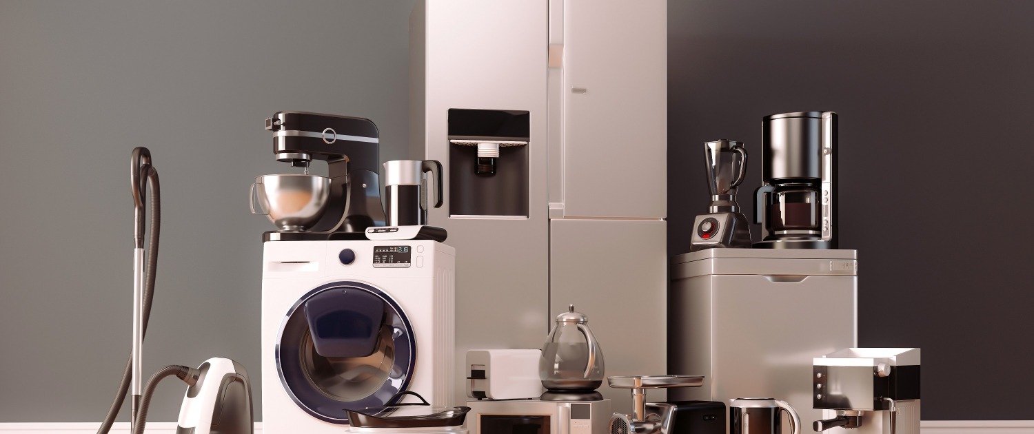 A group of home appliances sitting on a wood floor