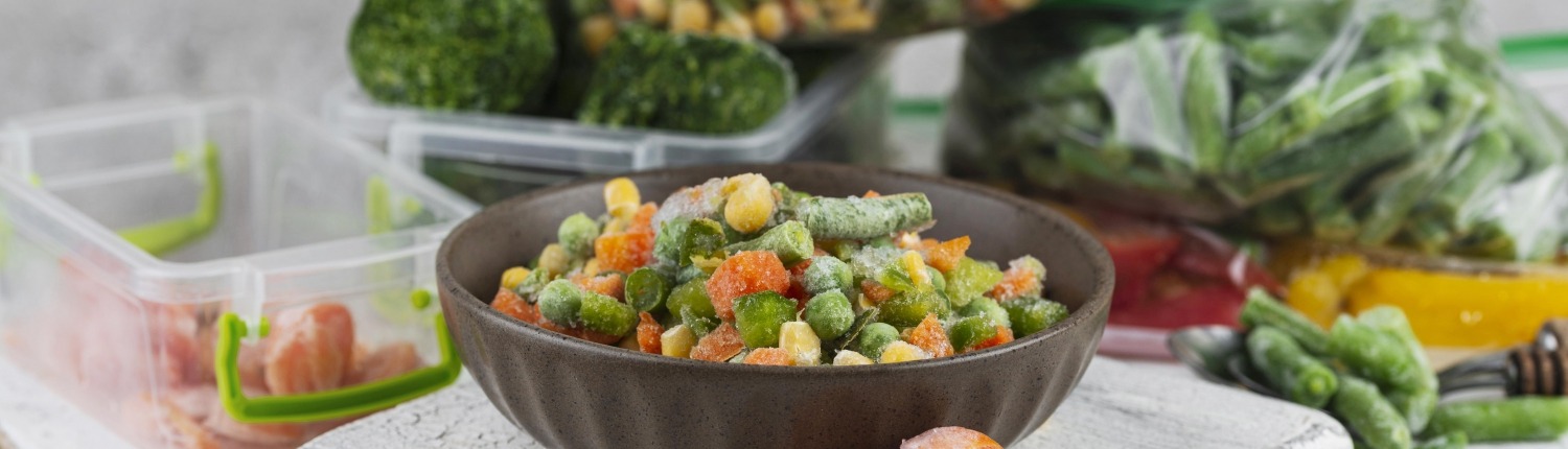 Freezer burned peas and carrots on table