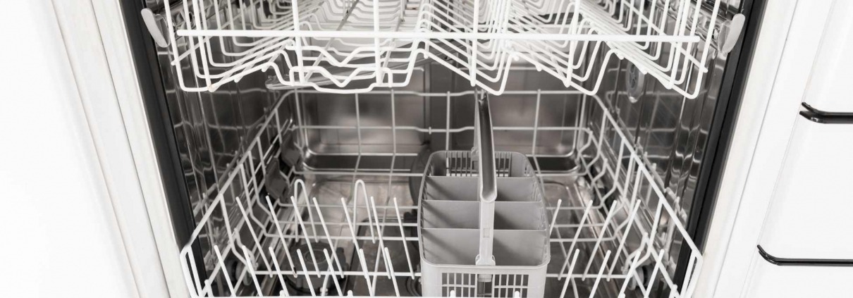 Interior shot of a dishwasher and racks