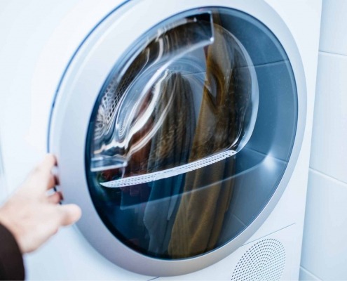 Energy efficient heat pump dryer in a modern laundry room