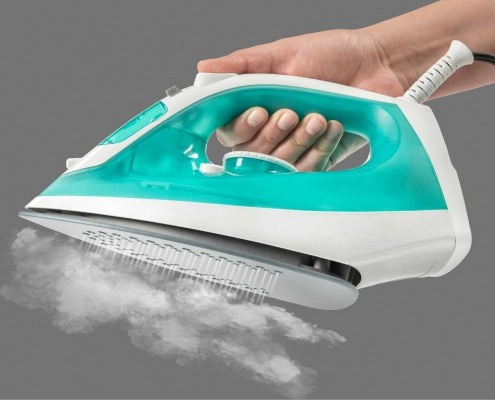 Clean and well-maintained clothing iron, essential for effective garment care.