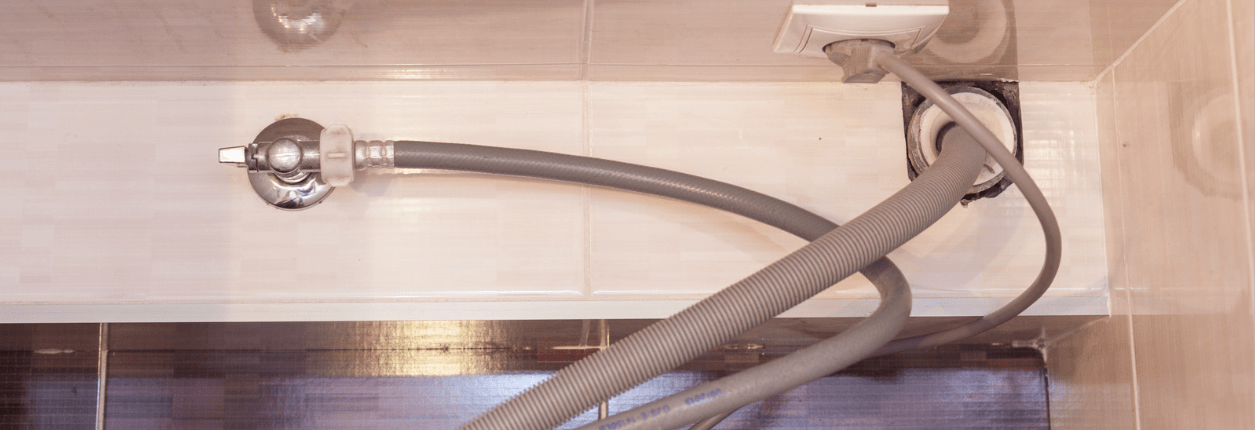Dishwasher drain hose underneath the sink