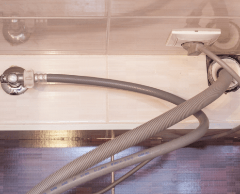 Dishwasher drain hose underneath the sink