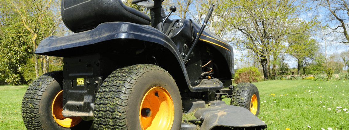Lawnmower in yard after troubleshooting unever cutting