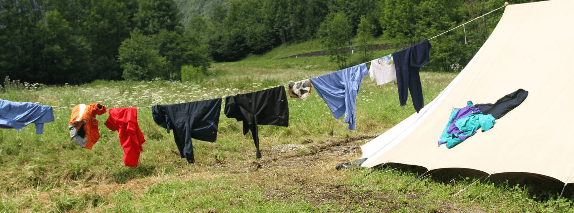 How to Hand Wash Clothes While Camping while drying them on a clothes line