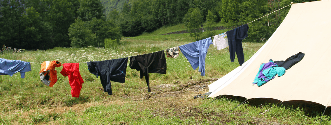 How to Hand Wash Clothes While Camping while drying them on a clothes line