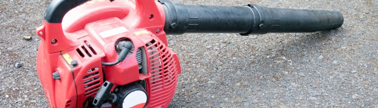 leaf blower unplugged laying on ground