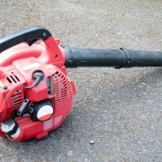 leaf blower unplugged laying on ground
