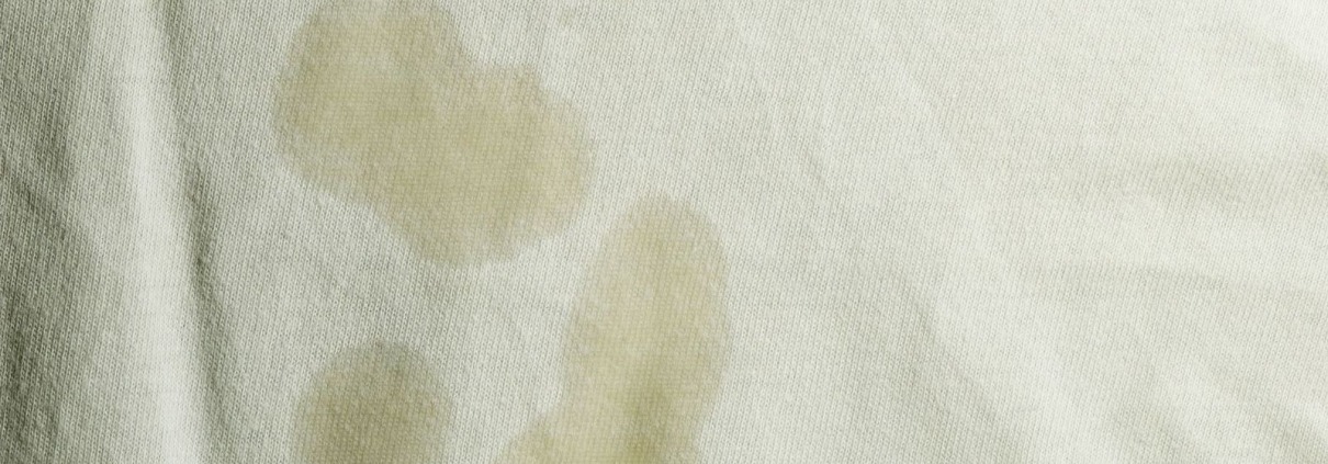 close up of stains on white garment