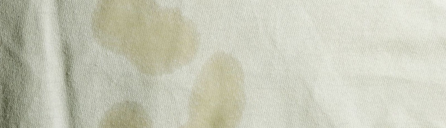 close up of stains on white garment