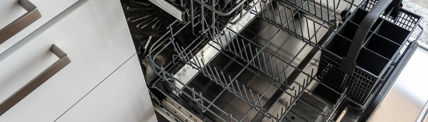 Dishwasher pulled out to inspect dishwasher insulation