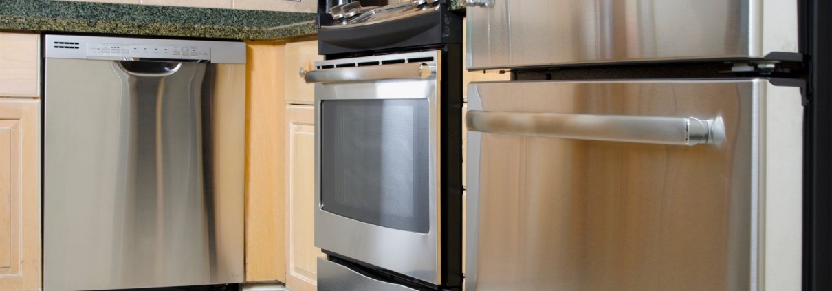 clean and shiny stainless steel appliances in kitchen