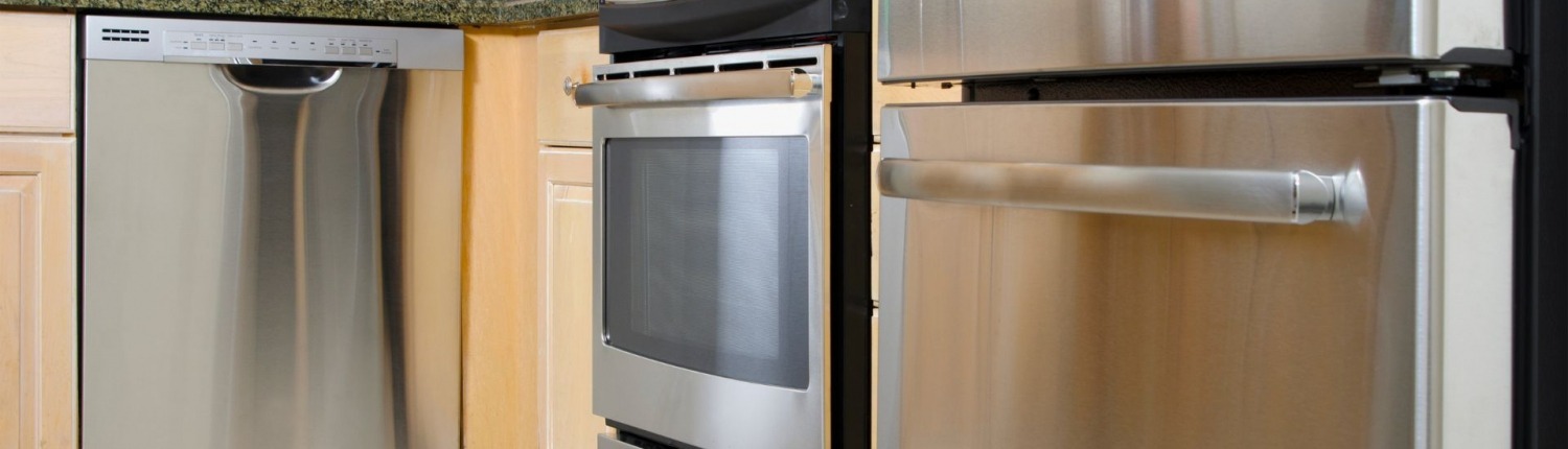 clean and shiny stainless steel appliances in kitchen