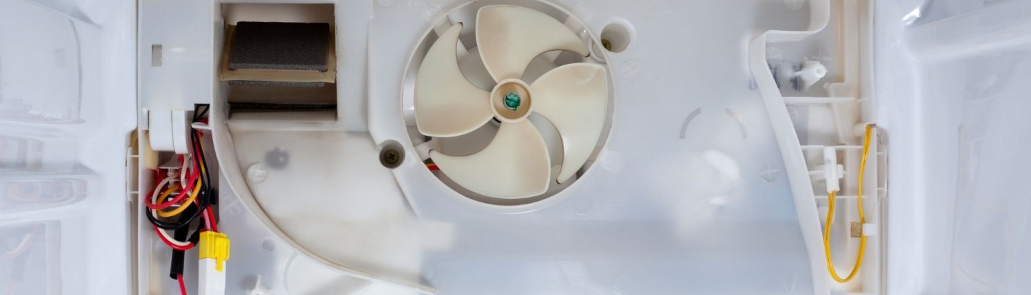 interior of refrigerator with fan and wiring
