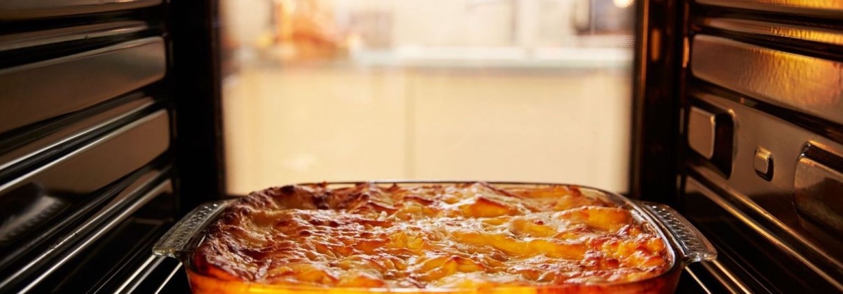 open oven interior with casserole resting on rack