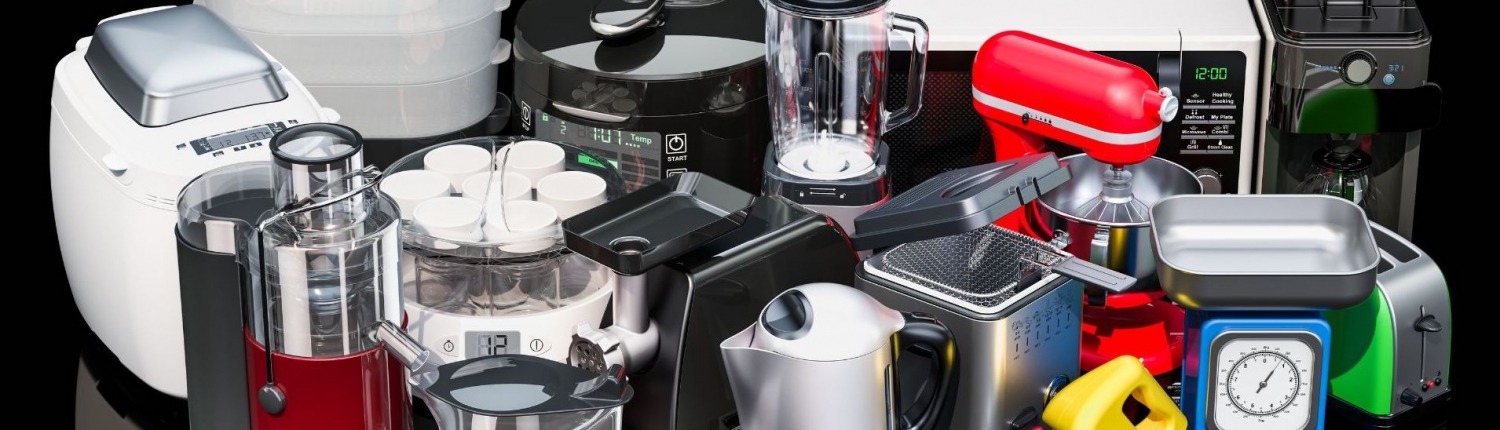 various colored small kitchen appliances displayed on black countertop