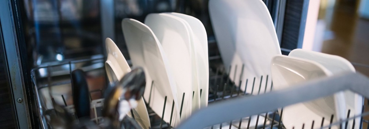 open dishwasher with dishes in racks