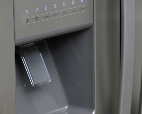 ice maker and water dispenser on outside of refrigerator door