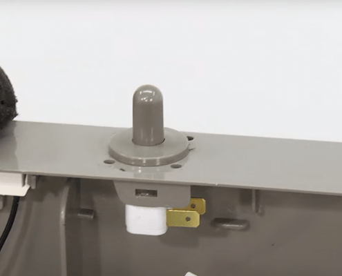 Door switch on a refrigerator being replaced