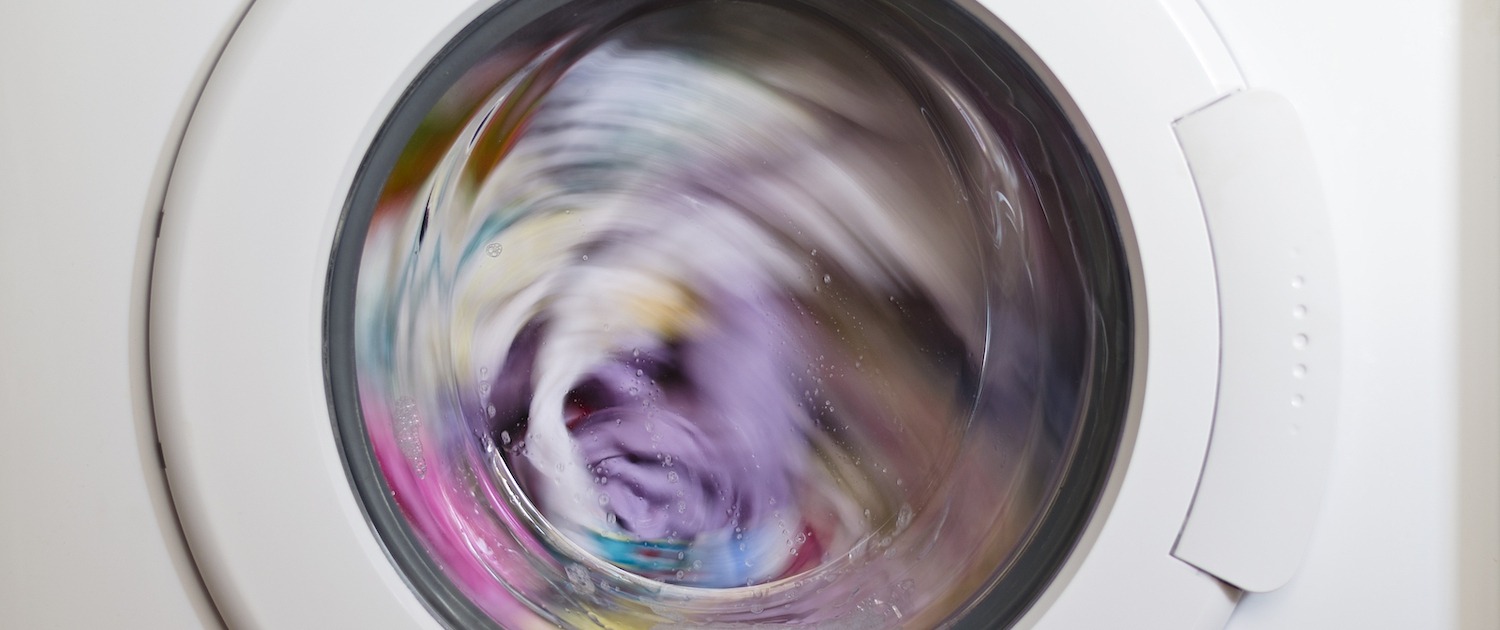 Washing,Machine,Door,With,Rotating,Garments,Inside