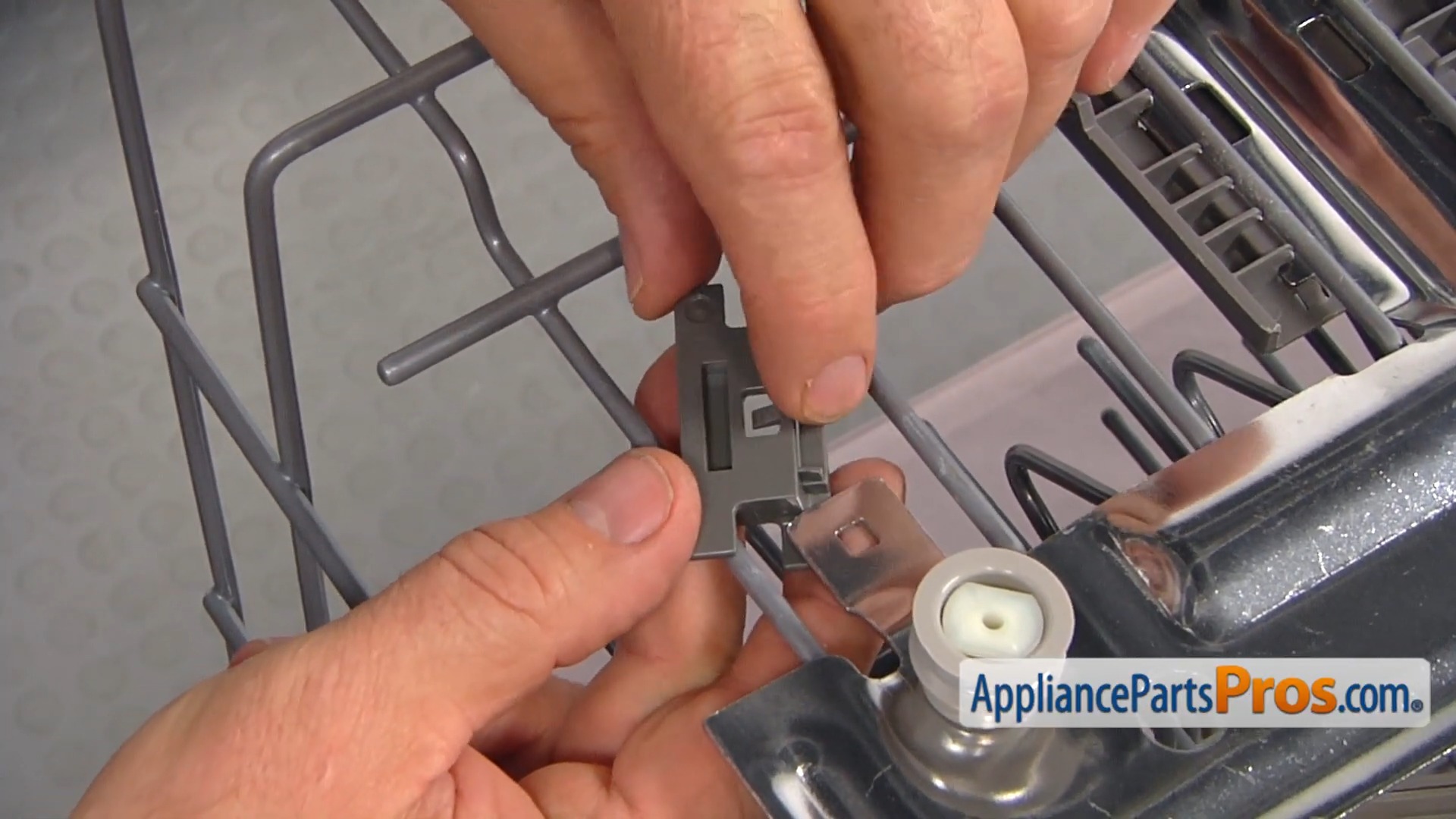 Hands installing Whirlpool positioner brackets