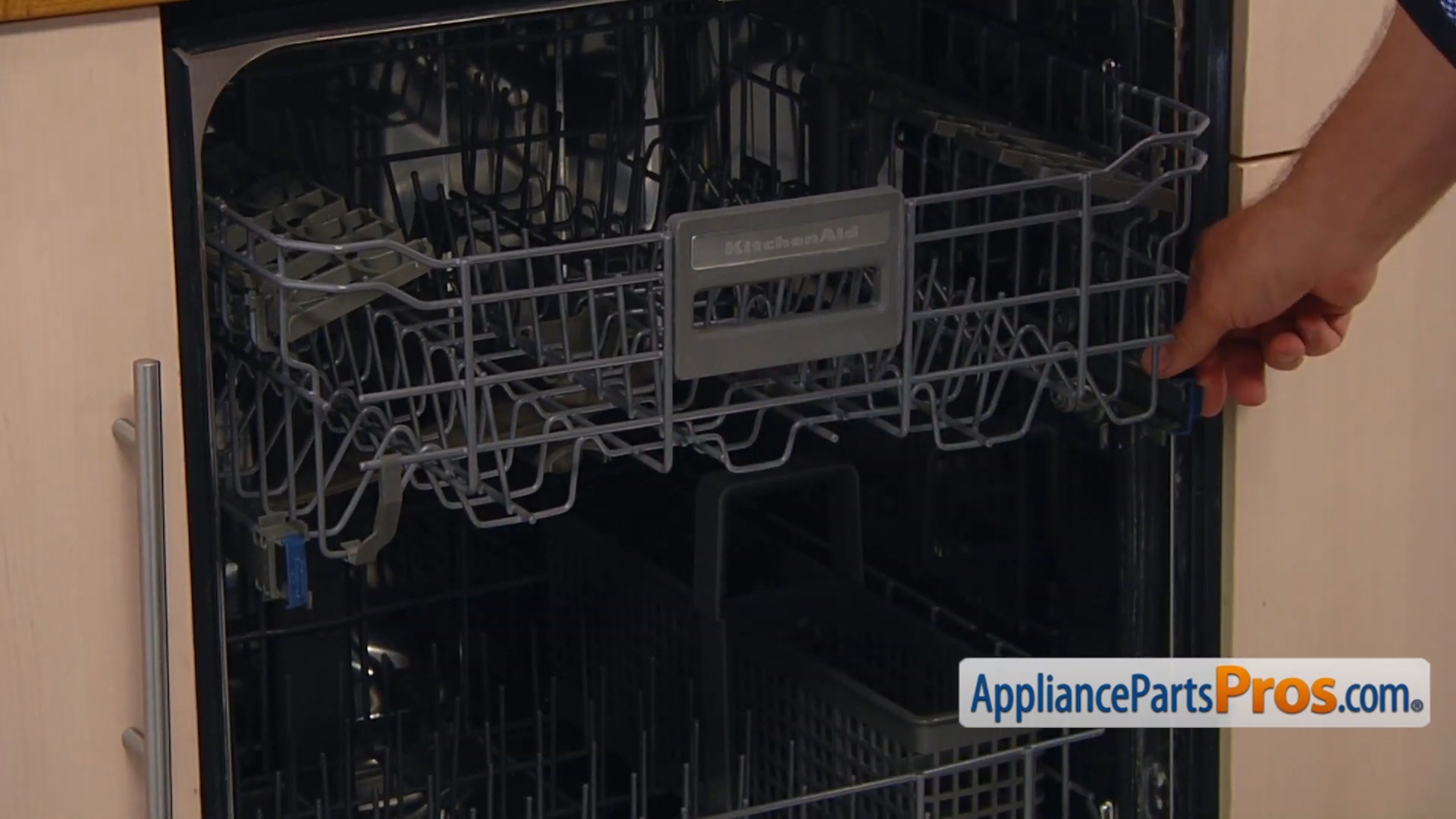 Hands reassembling the Whirlpool dishwasher rack and adjuster assembly