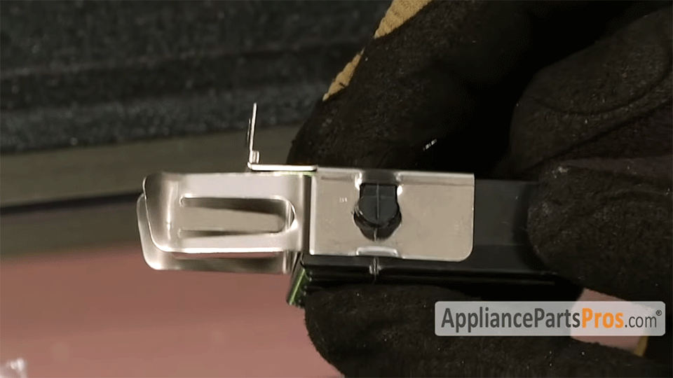 slide the bracket onto the plastic terminal block