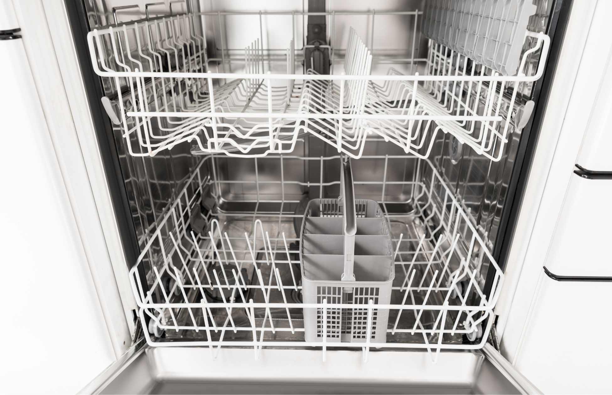 Interior shot of a dishwasher and racks