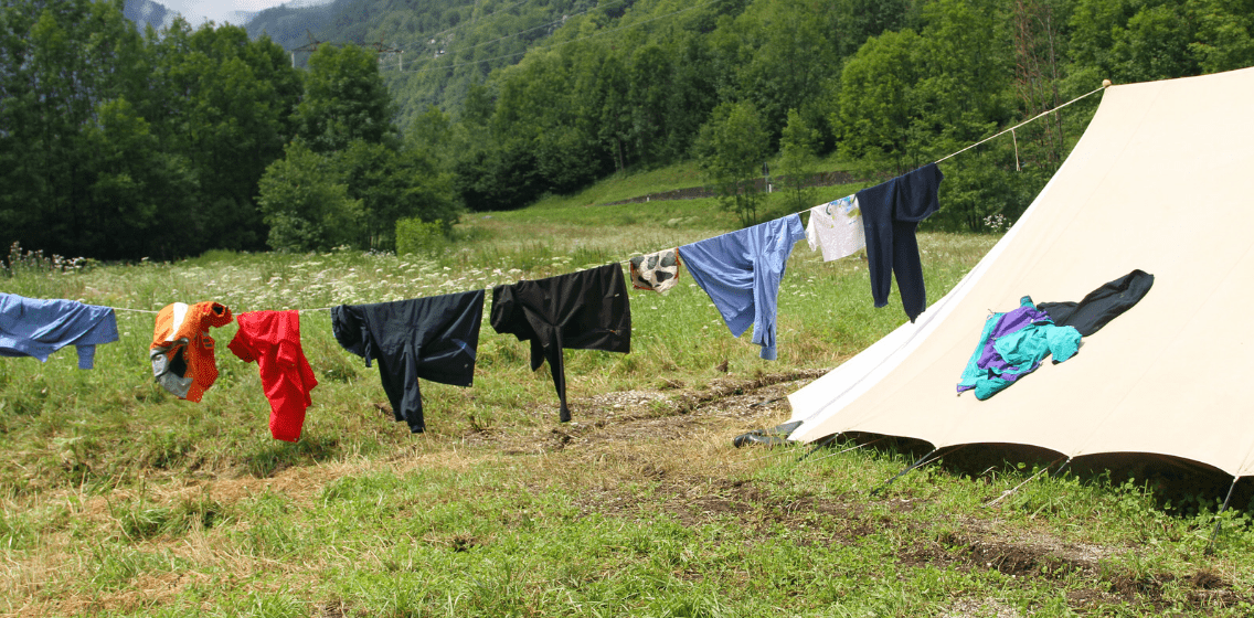 How to Hand Wash Clothes While Camping while drying them on a clothes line