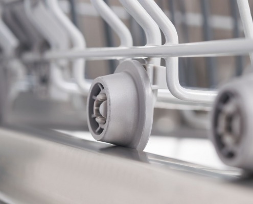 white dishrack roller wheel assembly extended