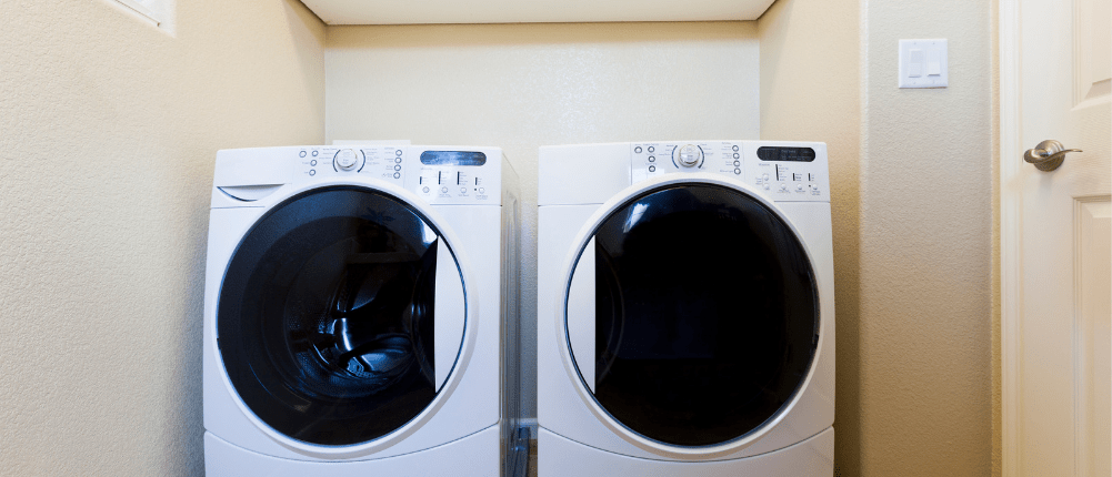 Washing machine and dryer in a laundry room after troubleshooting E10 error code