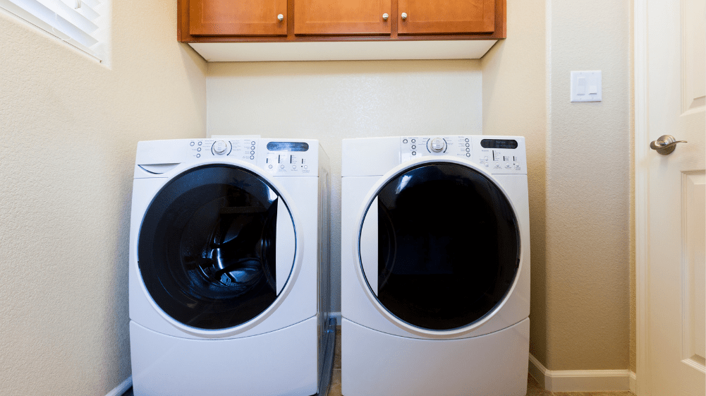 Washing machine and dryer in a laundry room after troubleshooting E10 error code