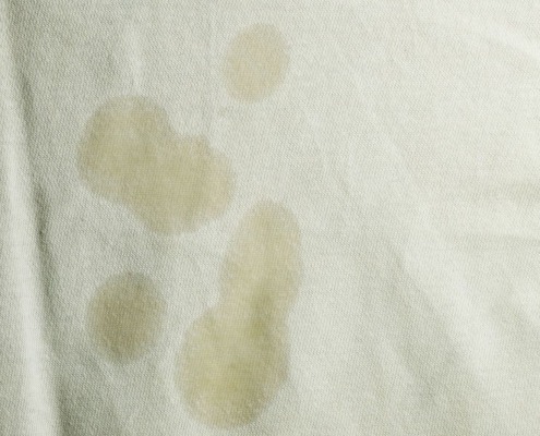 close up of stains on white garment