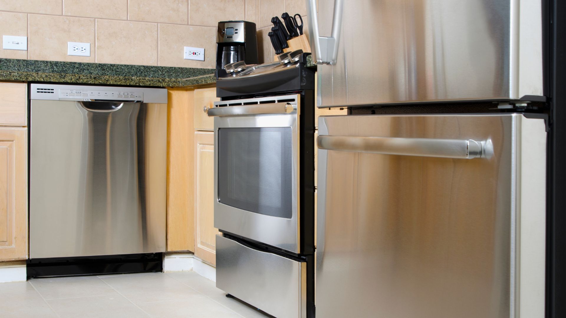 clean and shiny stainless steel appliances in kitchen