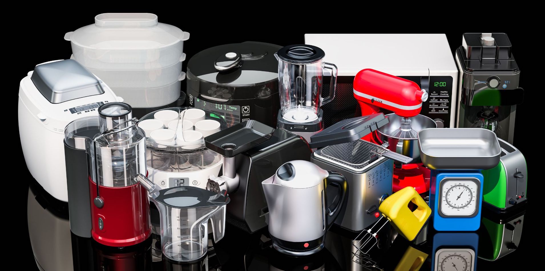 various colored small kitchen appliances displayed on black countertop